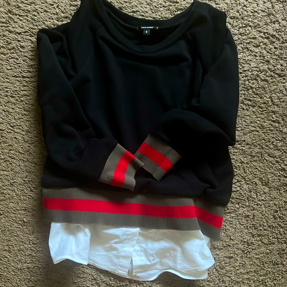 Black crew neck top with removable white shirt extension